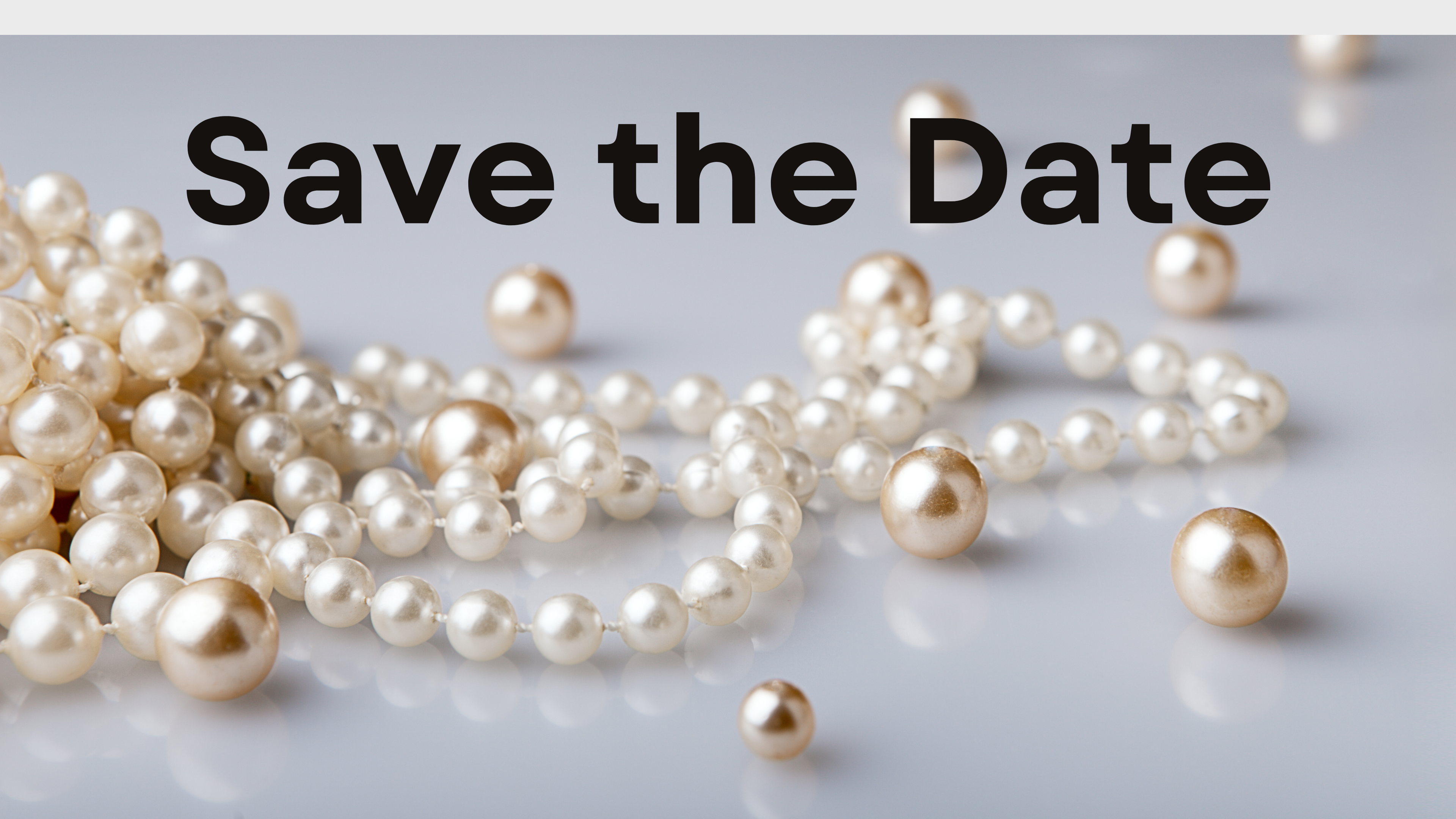 Save the Date with perals scattered across the image.