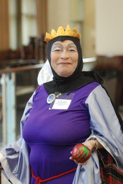 Lady in purple queen costume form Sleeping Beauty